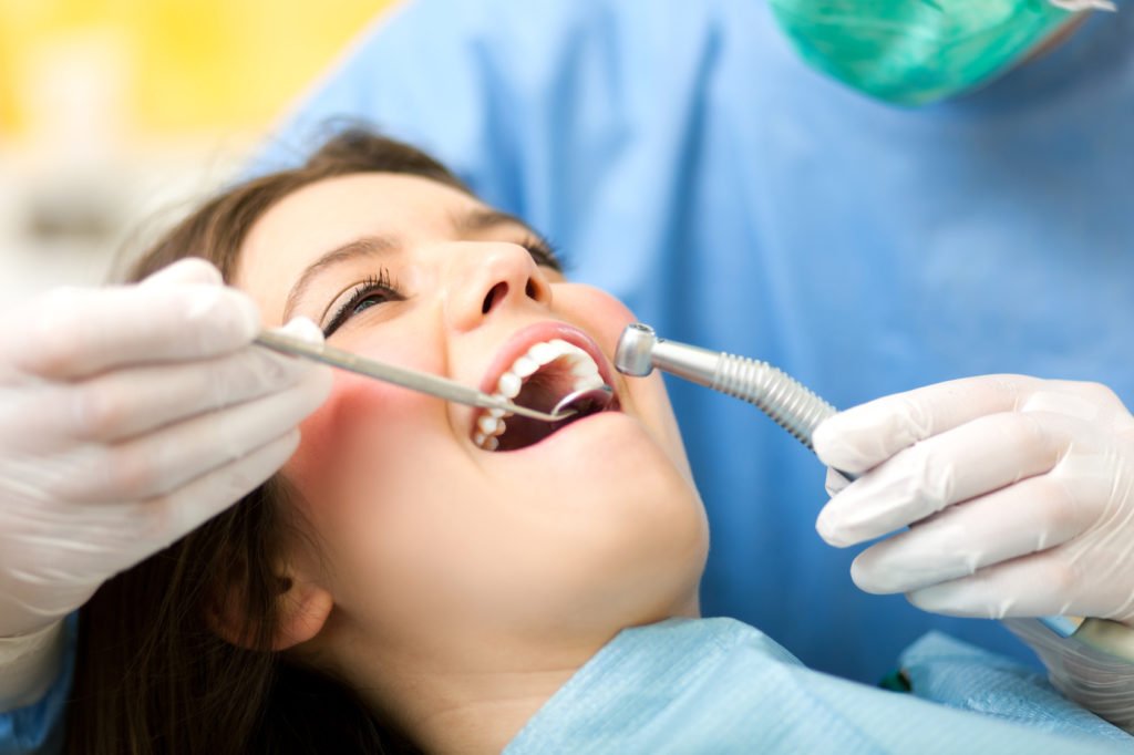 Dentist curing a